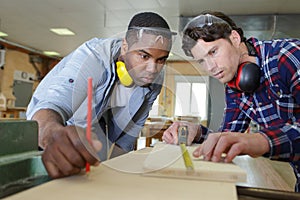carpenter with apprentice in training period