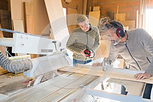 carpenter with apprentice in training period