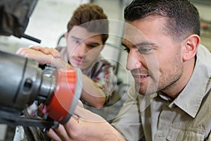 Carpenter and apprentice working together