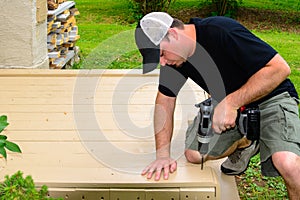 Carpenter Bulding Deck with Drill photo