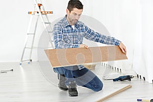 carpenter checking large board wood