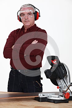 Carpenter with a circular saw.