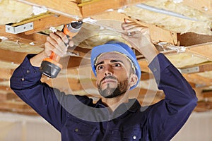 carpenter in construction site photo