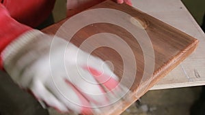 Carpenter covers the mordant plaque, dry wood