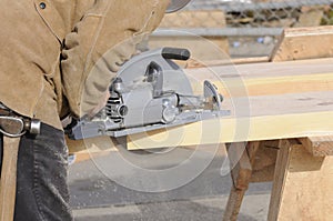 Carpenter cutting steps with saw