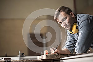 Carpenter designing wooden furniture