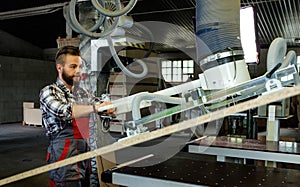 Carpenter doing his job in carpentry workshop