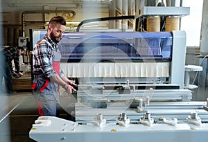 Carpenter doing his job in carpentry workshop