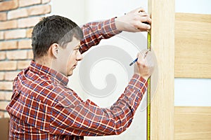 Carpenter at door installation