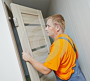 Carpenter at door installation photo