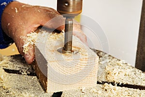 Carpenter at a drill