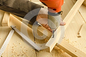 Carpenter drilling wood