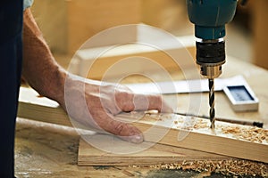 Carpenter Drilling Wood Closeup