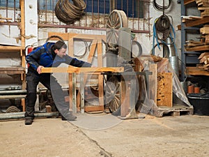 Carpenter on an electric saw machine