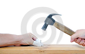 Carpenter with hammer and injured fingers