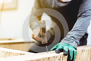 Carpenter hammer a nail