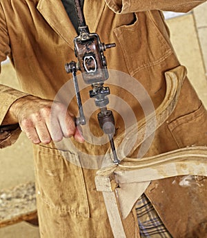 Carpenter with hand drill