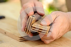 Carpenter hands at work with wooden boards