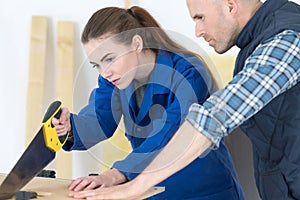 Carpenter and female trainee