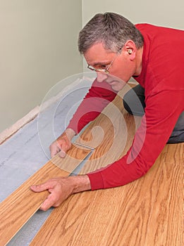 Carpenter installing floor