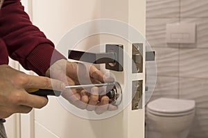 carpenter Installing the lock on the door Installation of the door lock