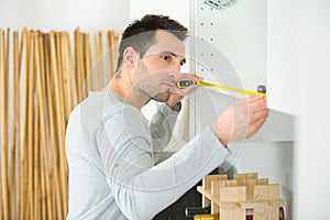 Carpenter installing luxury fitted kitchen