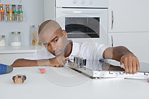 Carpenter installing luxury fitted kitchen