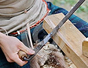 Carpenter job a piece of wood with an ancient woodworking technique photo