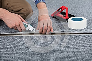 Carpenter Laying Carpet