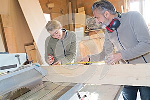 carpenter learning during measuring apprenticeships lesson photo
