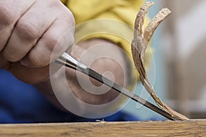 Carpenter makes a hole in a wooden door to the mortise lock with