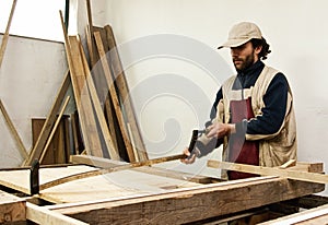 Carpenter making furniture