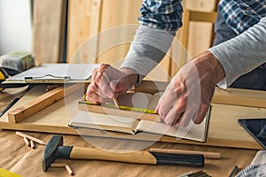 Carpenter making picture frame in workshop