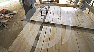 Carpenter making wooden bed.