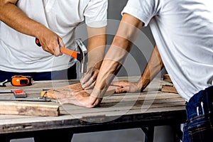 Carpenter man hammering a nail