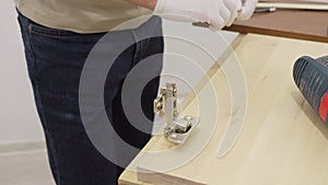 Carpenter man measuring raw board for his carpentry project.