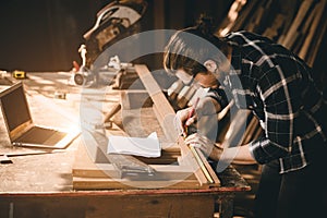 Carpenter man Wood worker working hand made furniture in shop factory industry. male wooden craftsman builder working in workshop