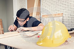 Carpenter Man is Working Timber Woodworking in Carpentry Shophouse, Craftsman is Measuring Timber Frame for Wooden Furniture in