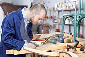 Carpenter measuring wooden plank