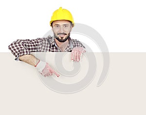 Carpenter pointing at blank board