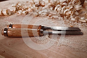 Carpenter's chisel, woodwork tool on the desktop in the workshop