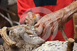 A carpenter sawing