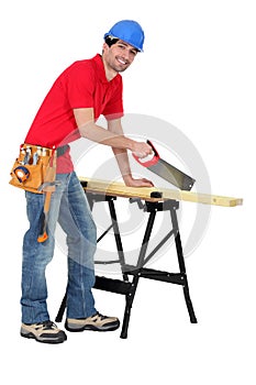 Carpenter sawing