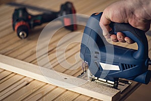 Carpenter sawing wood