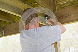 Carpenter securing deck