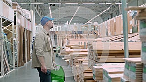Carpenter selecting wood in a hardware store