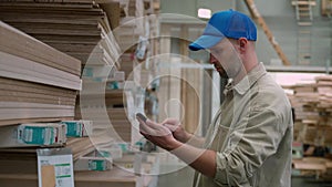 Carpenter selecting wood in a hardware store