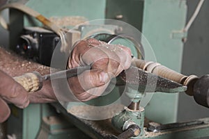 Carpenter Shaping Wood on a Lathe