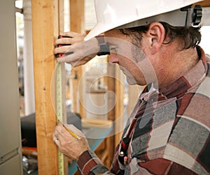 Carpenter Taking Measurements