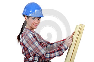 Carpenter taking measurements